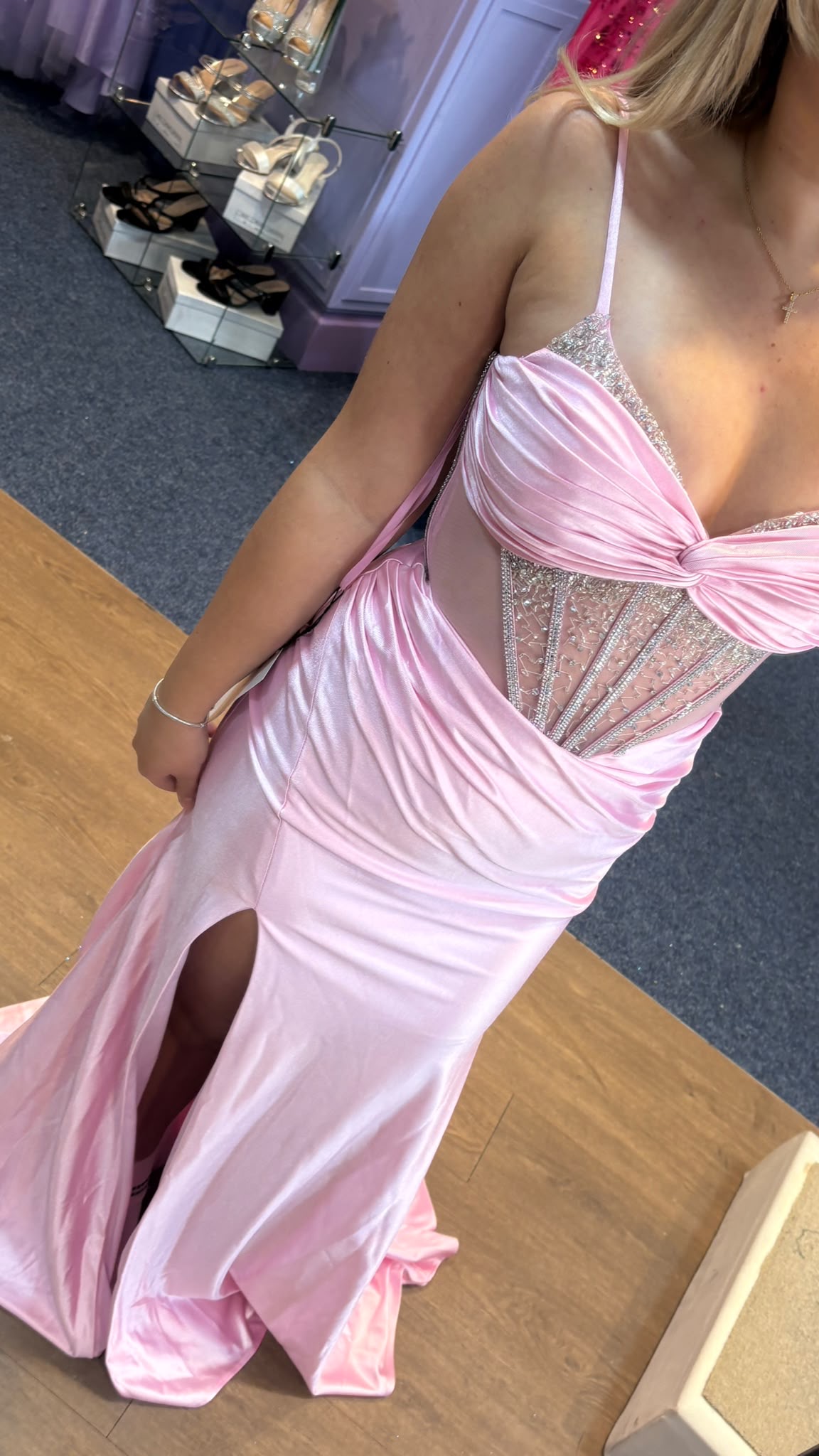 Blush-pink satin prom dress with sparkling corset bodice, draped bust and high leg slit in MK Outlet showroom