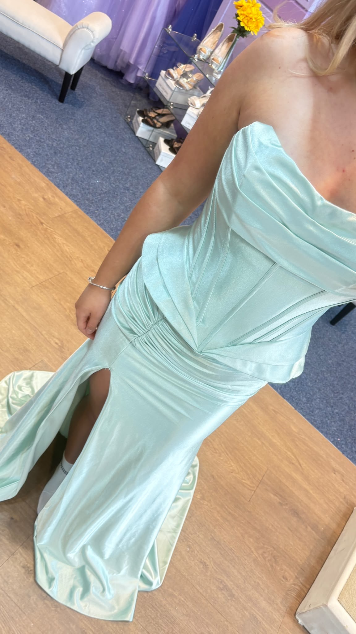 Ice-mint strapless satin prom gown with structured bodice, flattering ruching and high front slit at MK Outlet showroom